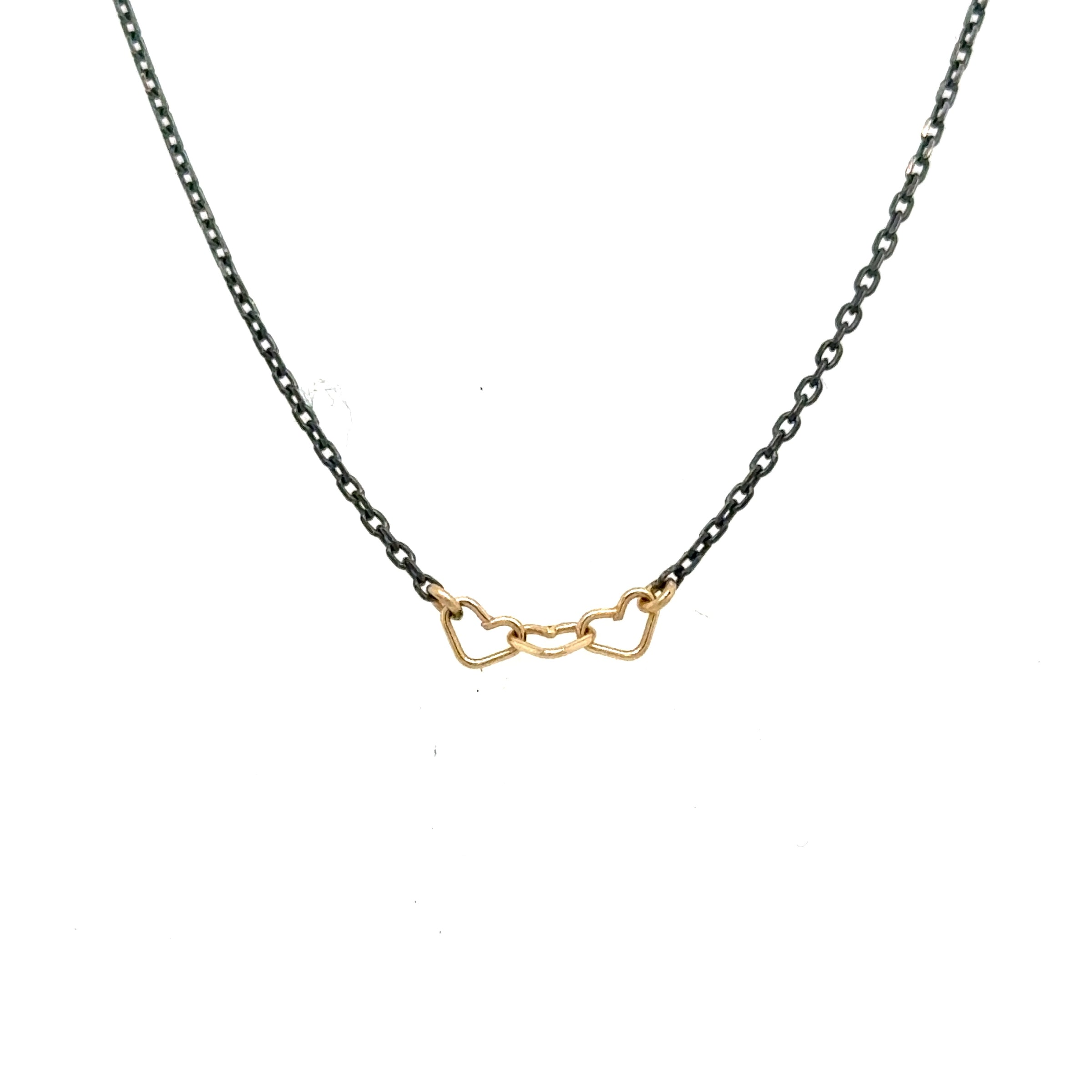 handmade necklace with 3 tiny 14K yellow gold wire hearts on oxidized sterling silver chain