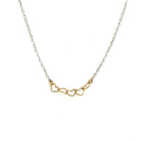 image of handmade necklace with 5 tiny 14K wire hearts on polished sterling silver chain