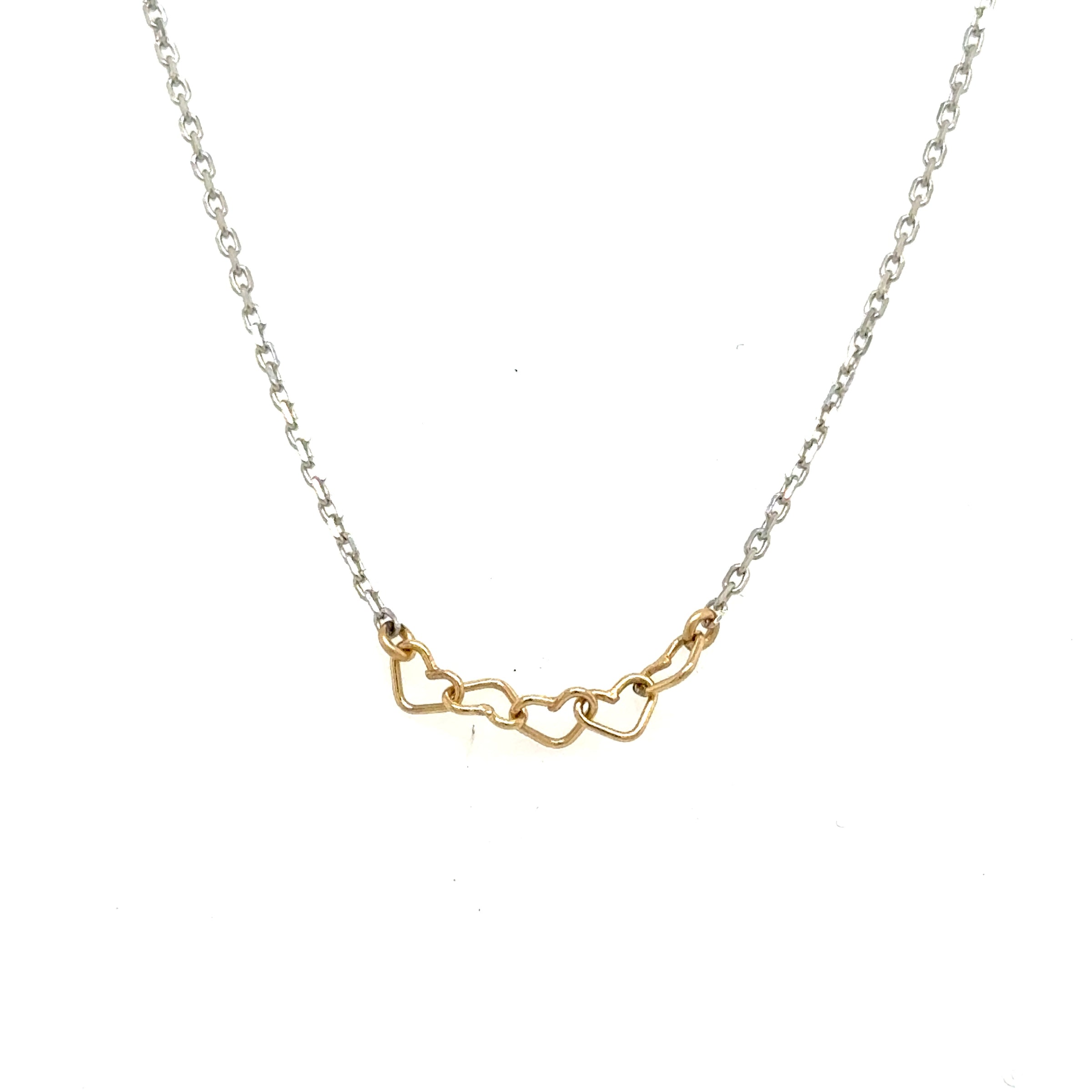 image of handmade necklace with 5 tiny 14K wire hearts on polished sterling silver chain