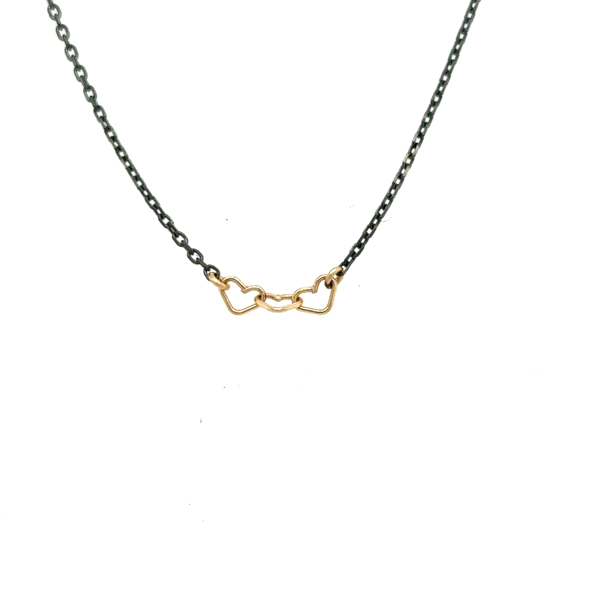 image of handmade necklace with 3 tiny 14K yellow gold wire hearts on oxidized sterling silver chain